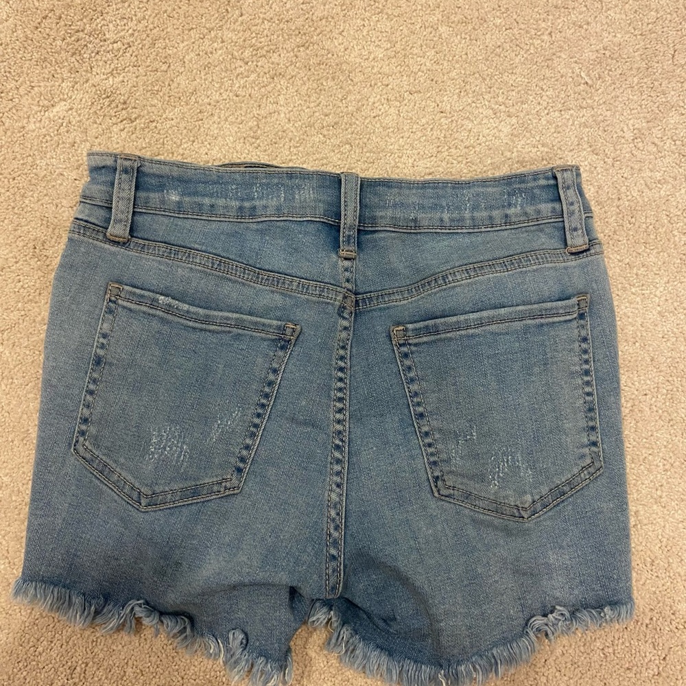 Light blue ripped jean shorts